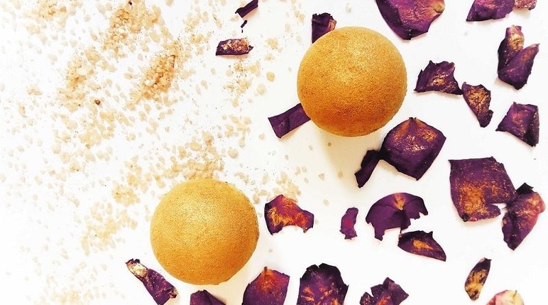 yellow DIY bath bombs covered in golden mica powder