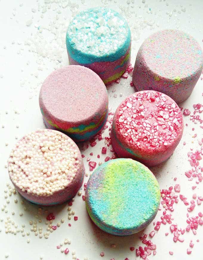 A set of mini bath bombs all with different colors and finishes