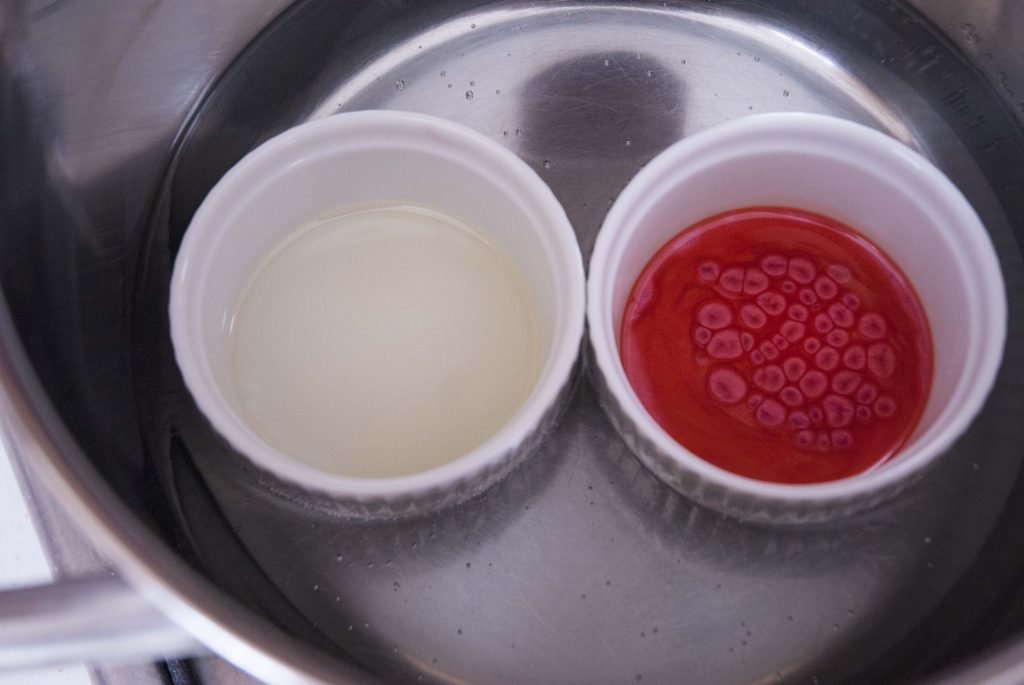 two colored layered homemade lip balm adding red mica powder to make red white layered candy cane lip balm