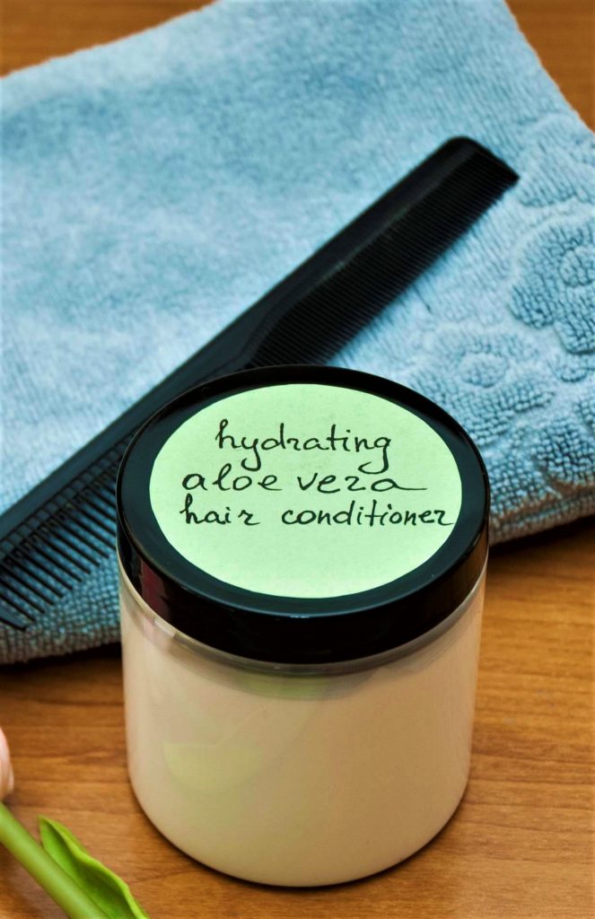 moisturizing aloe vera diy conditioner for hair that is dry next to towel and hair brush