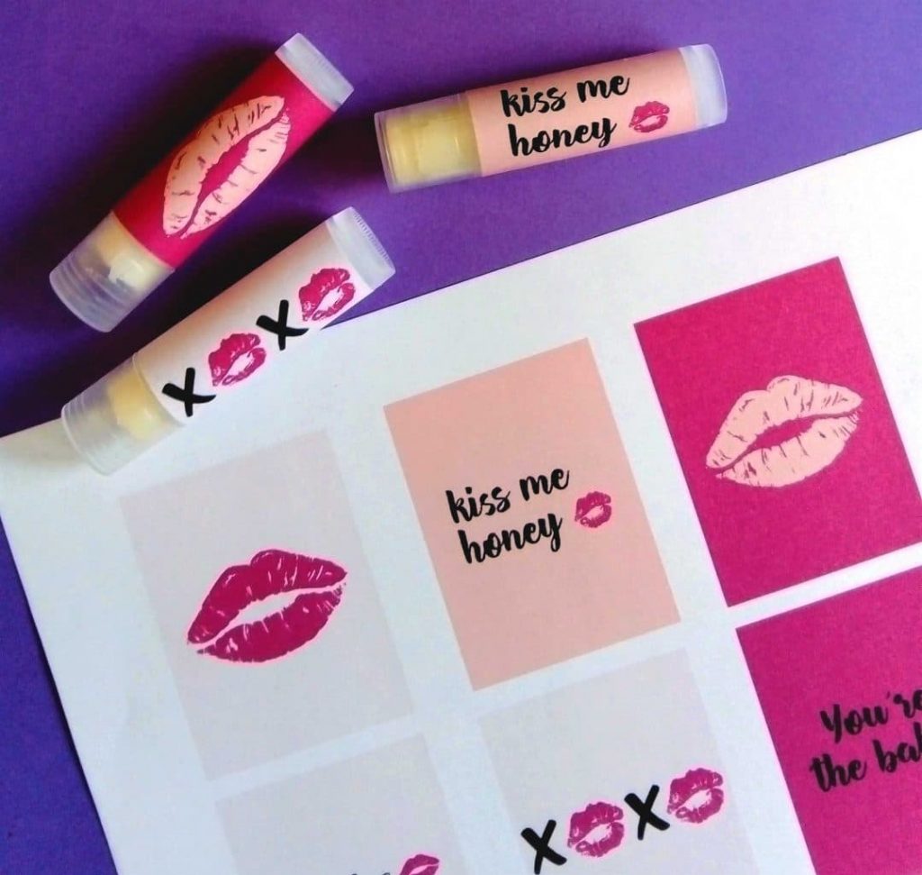 printable lip labels displayed next to decorated lip balm tubes