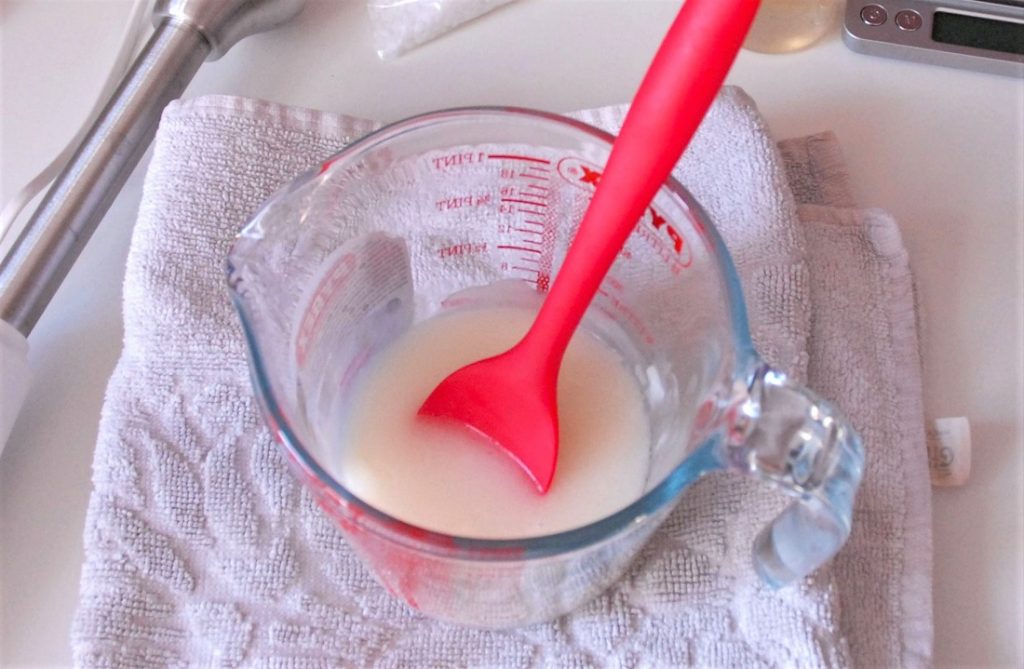 mixing DIY hair conditioner with spatula