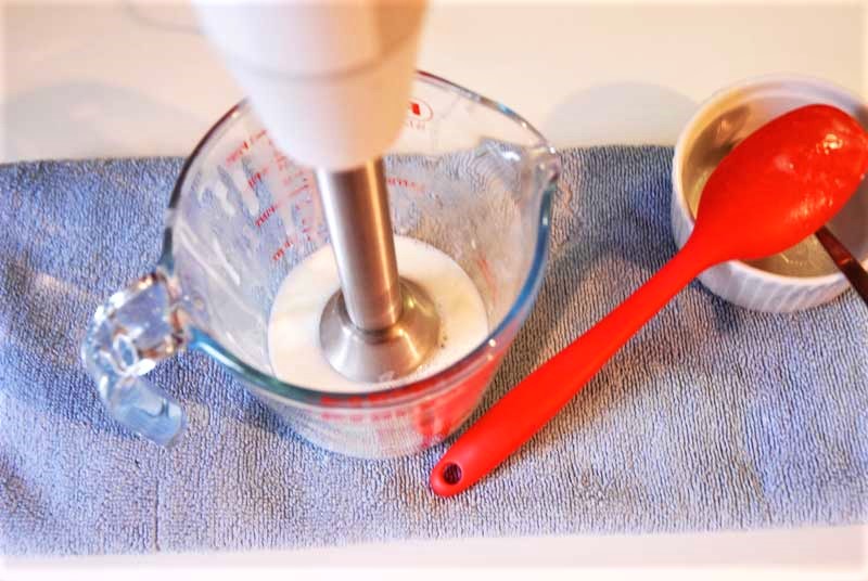 mixing DIY hand cream with immersion blender