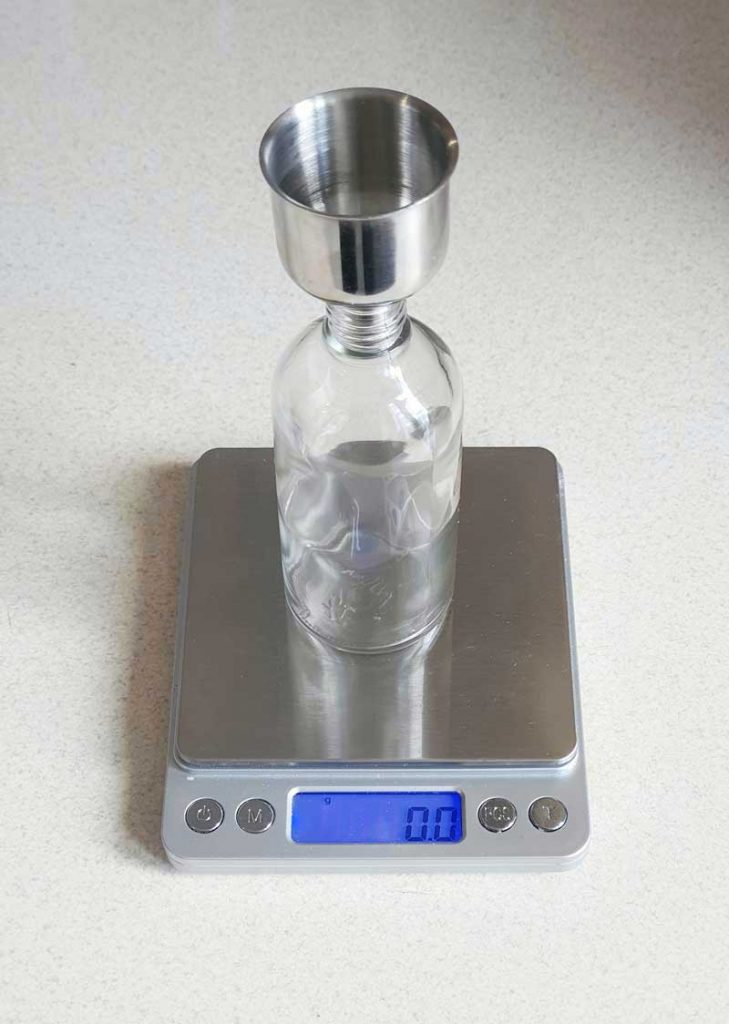 weighting oil using scales