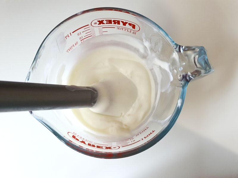 mixing homemade lotion with blender