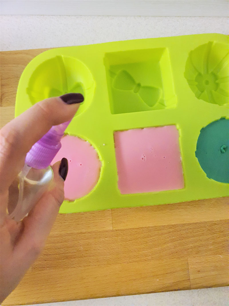 spraying soap to remove air bubbles