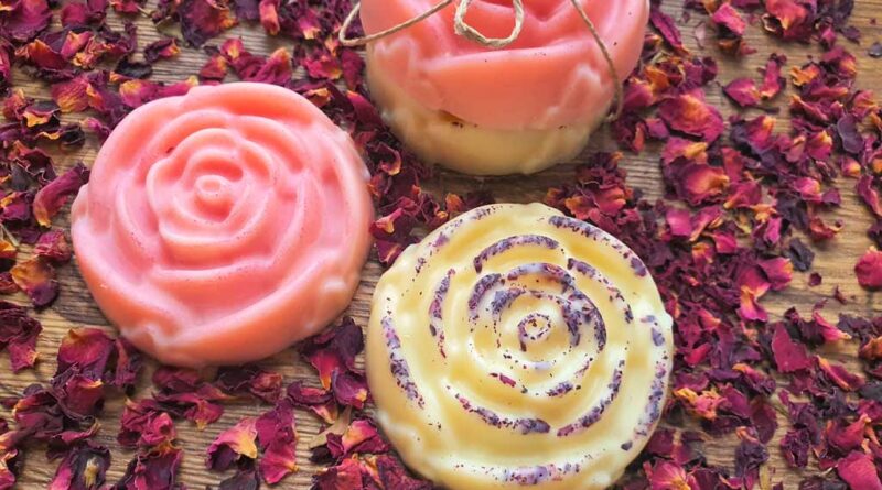 rose shaped and scented lotion bar recipe in pink and with rode petals