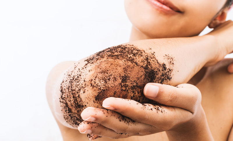 exfoliating skin with coffee scrub